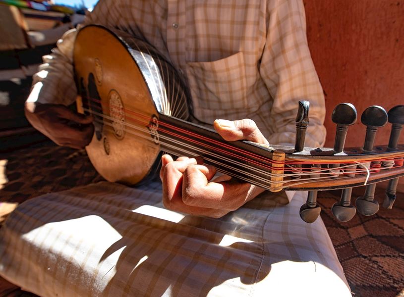 Bedouin man playing an Oud in Petra, Jordan