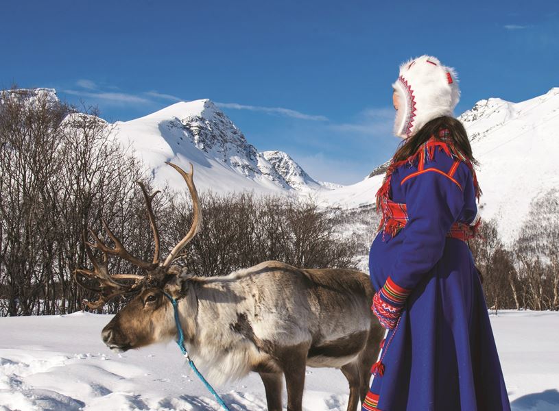 Sami girl with reindeer Tromso, Norway
