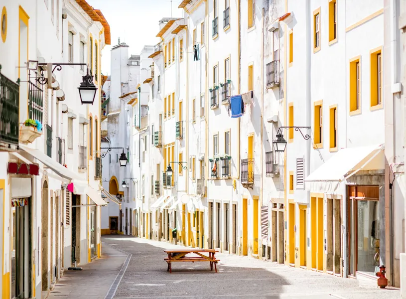 Street view with old residential buildings in Evora, Portugal