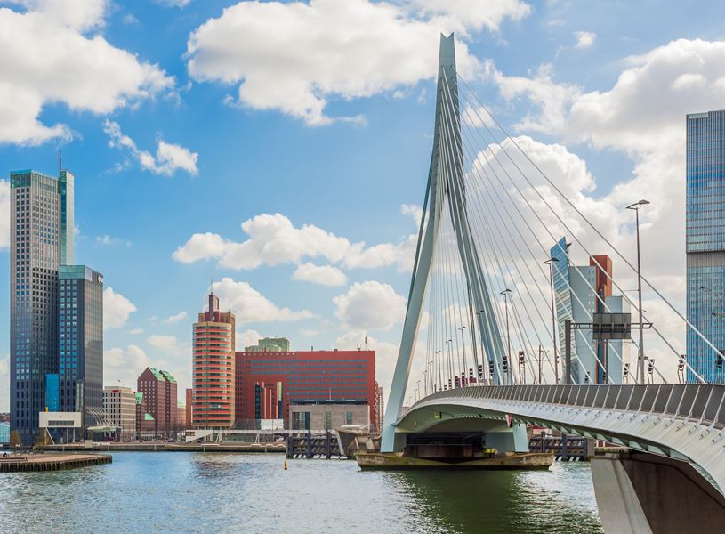 Erasmus bridge with city skyline in Rotterdam, Netherlands
