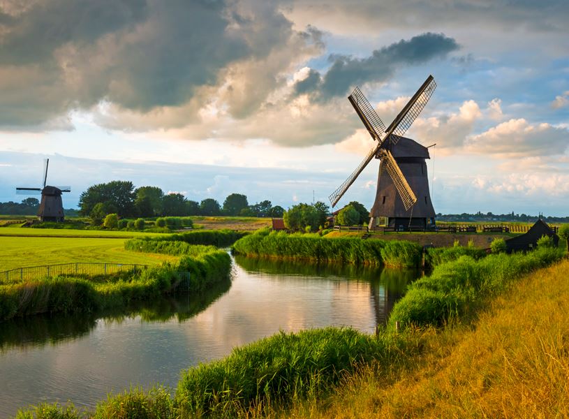 Windmill next to a canal in the Amsterdam area, Netherlands