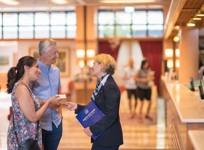 Guests are greeted by their Travel Director at their hotel 