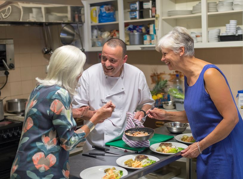 Guests learning from the Chef at the 19th Green Farm to Table dinner in Killarney, Ireland