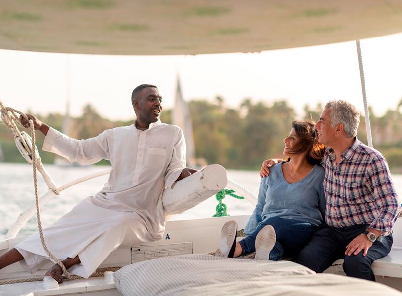 Guests meet local sailor on felucca Aswan, Egypt