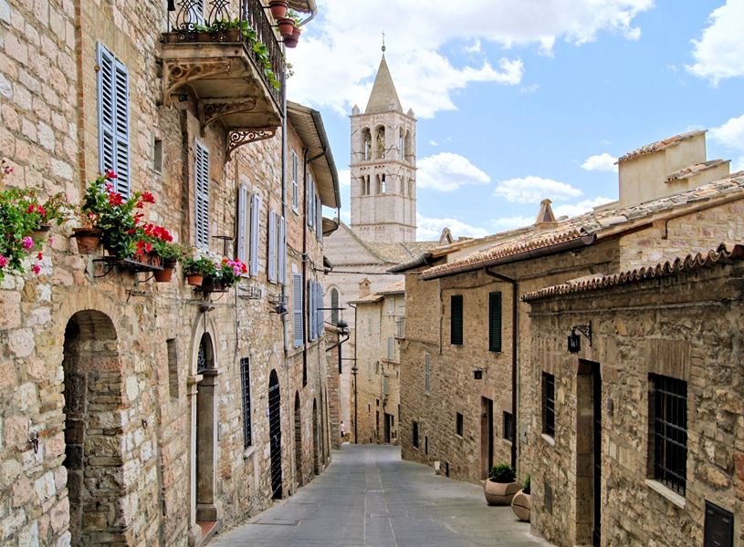 Narrow medieval street in the hill town of Assisi, Italy