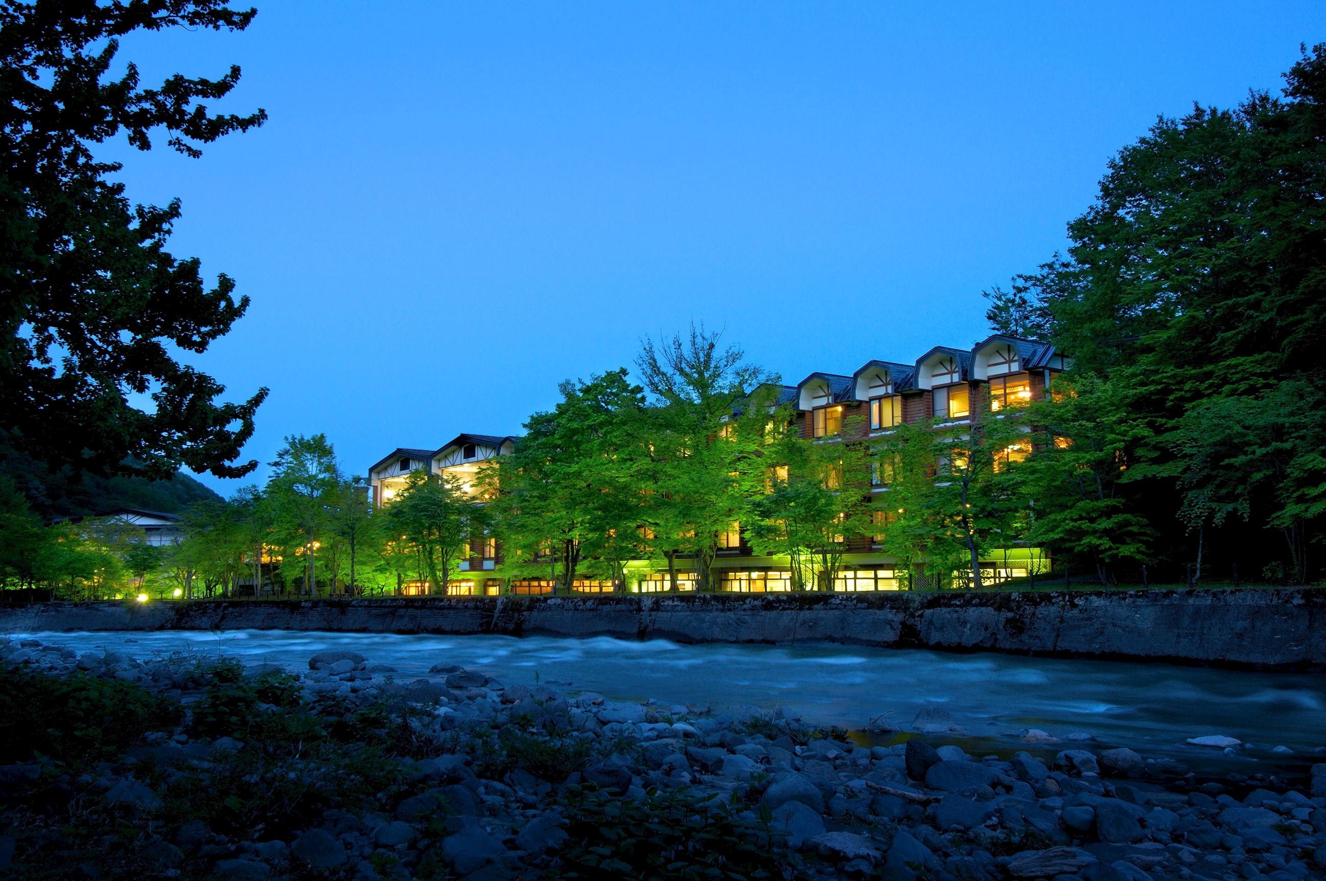 The exterior of the Hoshino Resorts Oirase Keiryu Hotel in Oirase Gorge, Japan