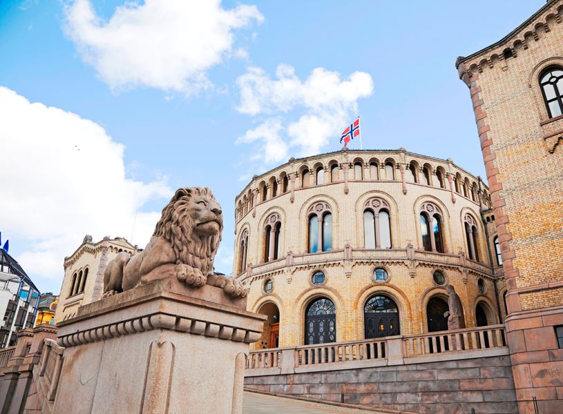 A lion statue in front of the Norwegian Parliament building in Oslo, Norway