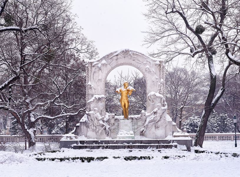 Mozart statue covered in snow in Vienna, Austria