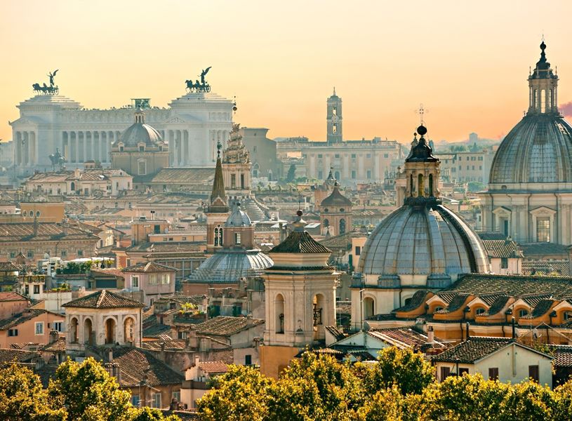An evening city scape with the Victor Emmanuel II National Monument in Rome, Italy