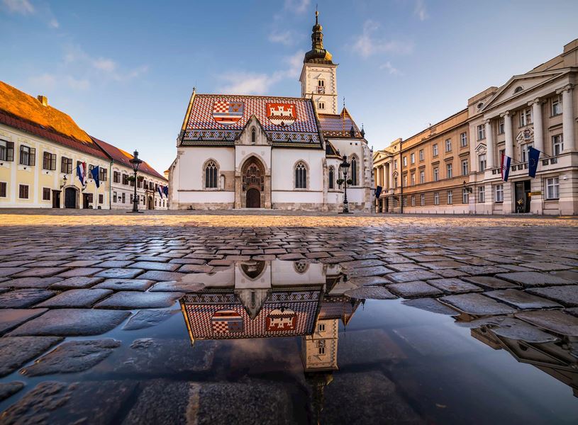 St Mark's Church and puddle reflection in Zagreb, Croatia