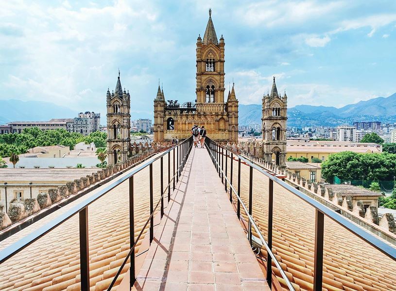 Panoramic view from Palermo Cathedral rooftop walkway with towers and city skyline
