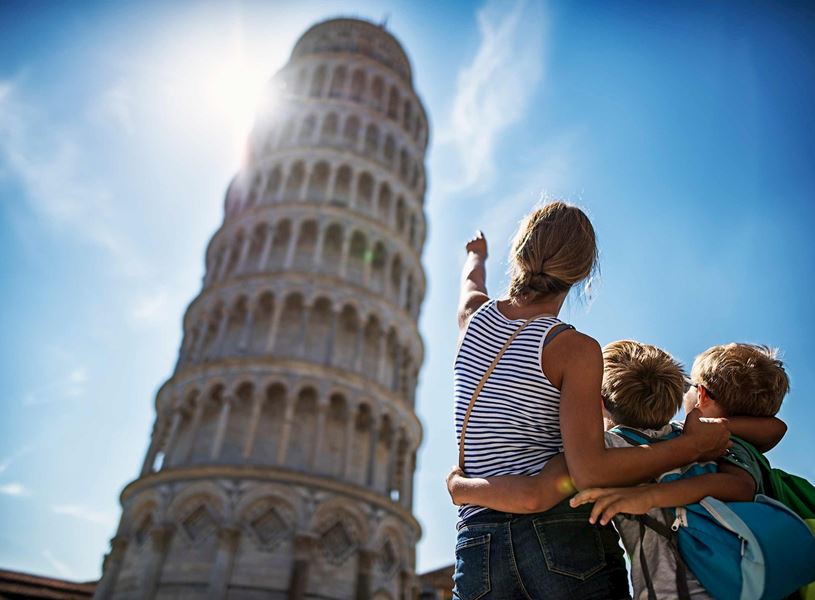 Family looking at the Leaning Tower of Pisa, Italy