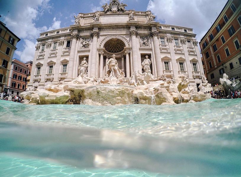 Trevi Fountain in Rome with marble statues and turquoise water 
