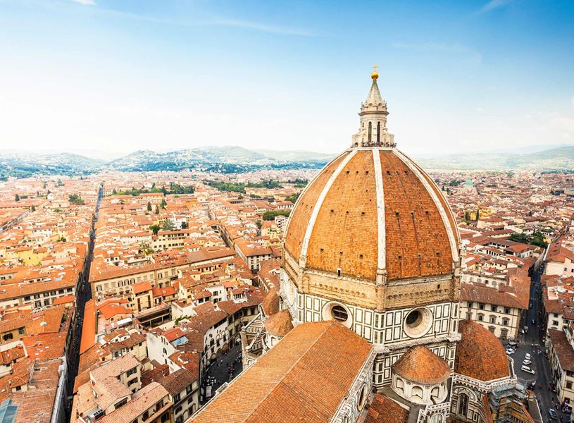 Duomo Santa Maria del Fiore dome towering over Florence city rooftops