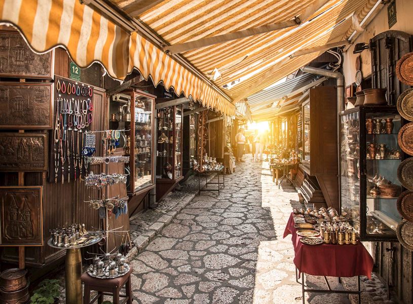 Market alley with shops and colourful awnings in Sarajevo, Bosnia and Herzegovina