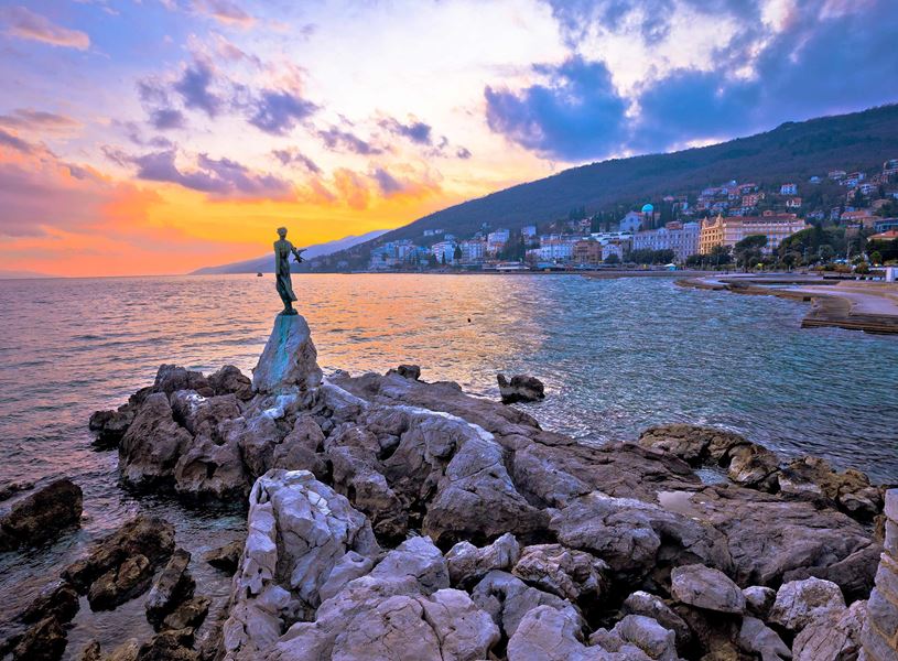 Maiden with the Seagull statue at sunset in Opatija, Croatia