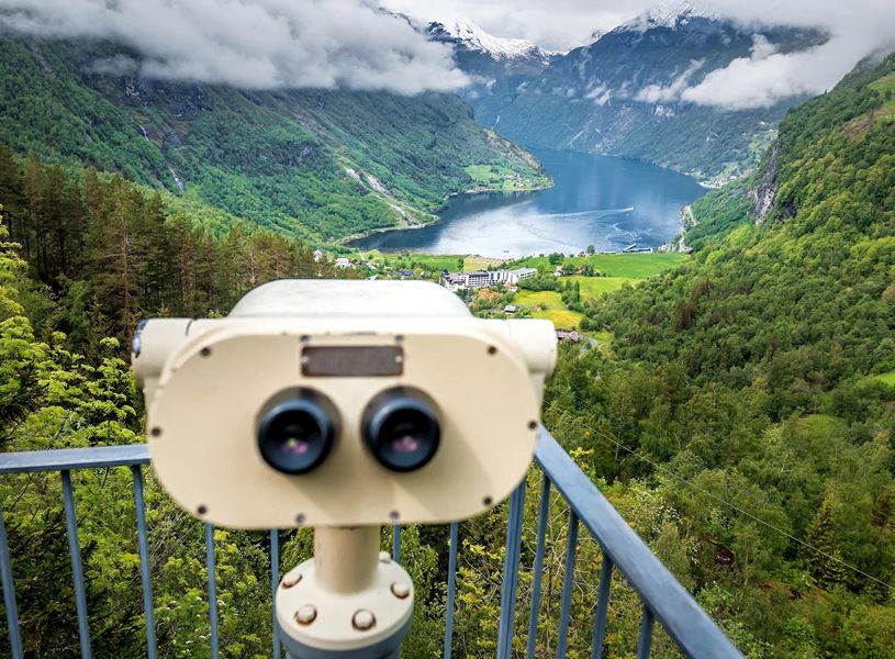 Viewing binoculars on platform overlooking Geirangerfjord, Norway