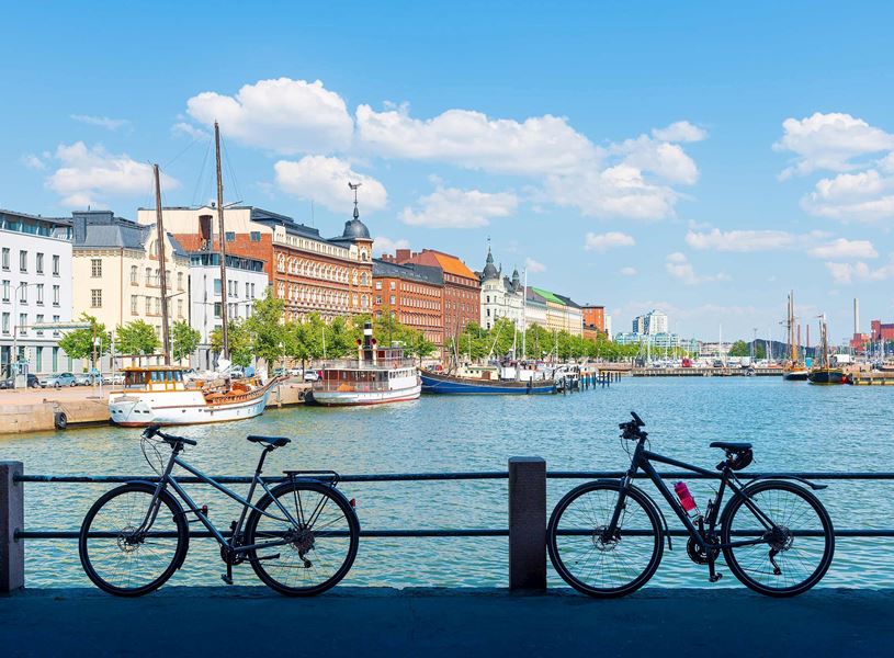 Old Port Pier Helsinki with bikes, boats and historic buildings in Finland