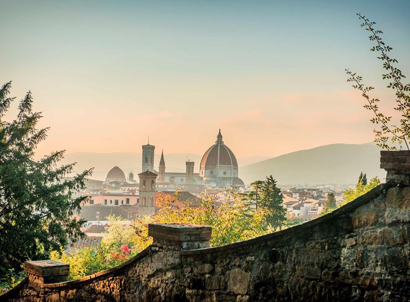 Florence skyline with Duomo Santa Maria del Fiore from hilltop at sunset