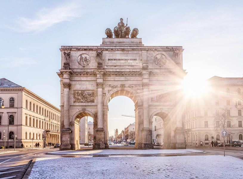 Siegestor triumphal arch with quadriga and sunlight flare in Munich, Germany