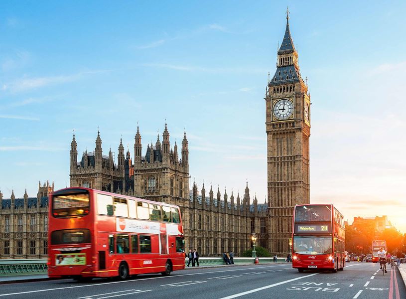  Big Ben and Westminster with red buses in London, England