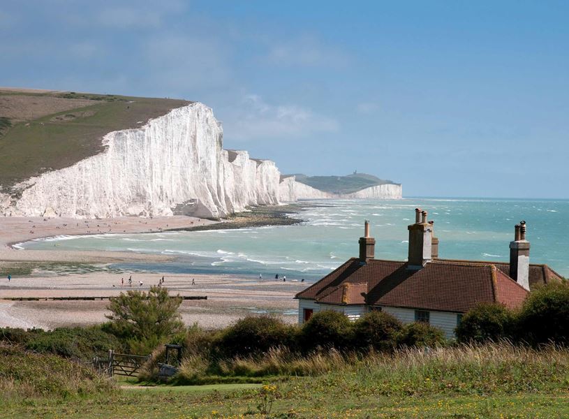 Seven Sisters Cliffs with coastal cottage in East Sussex, England