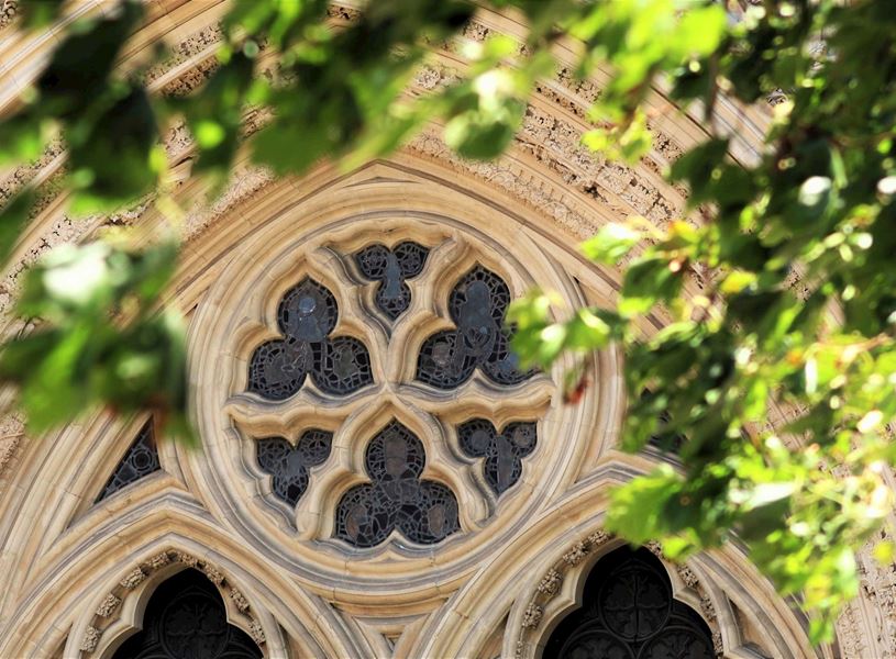 Gothic rose window with stone tracery and foliage in York Minster, England