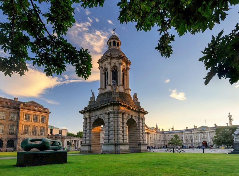 Trinity College Dublin Campanile with historic buildings and green quadrangle
