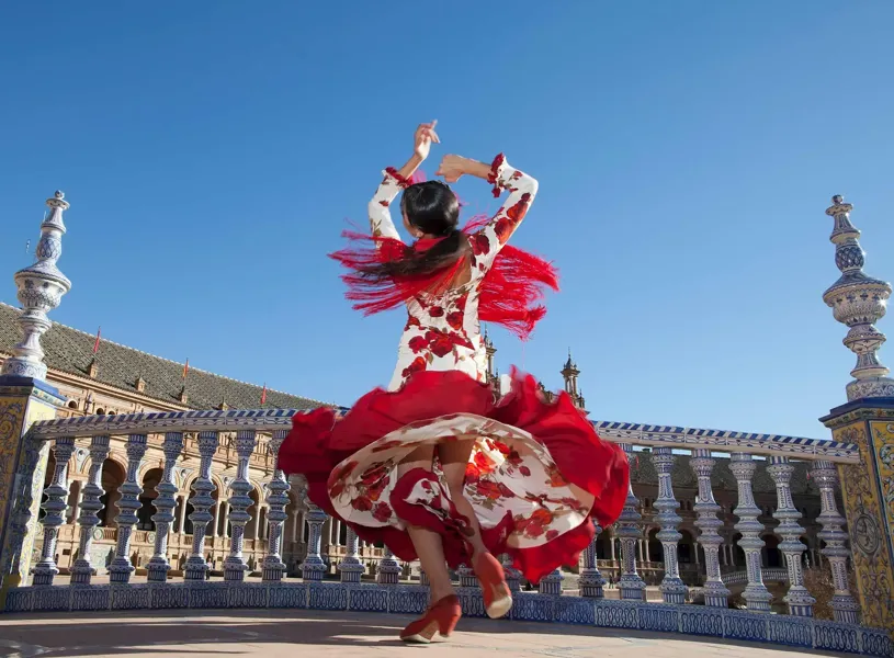 A flamenco dancer on a bridge in Seville, Spain 