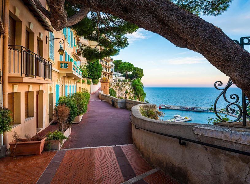 Walkway with buildings on the Rock of Monaco overlooking Port de Fontvieille