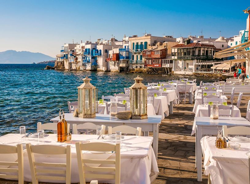 Chairs and tables in Little Venice, Mykonos, Greece