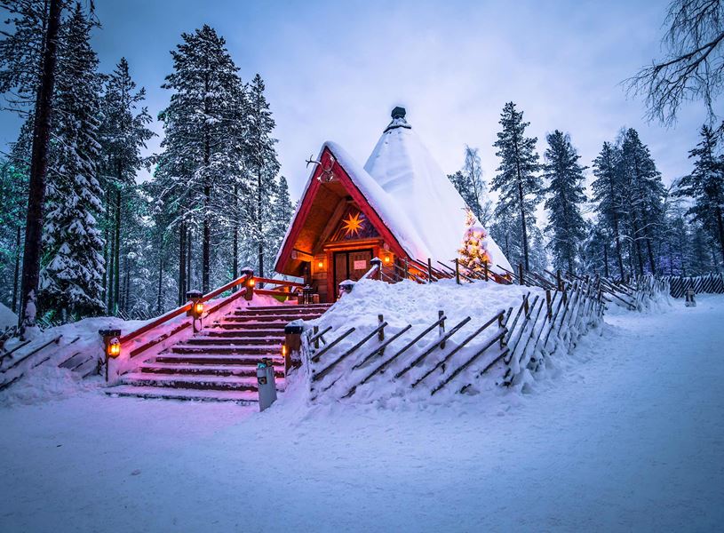 Snowy cabin in Santa Claus Village in Rovaniemi, Finland