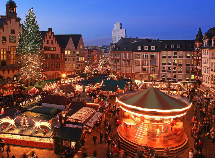 Frankfurt Christmas market with carousel, festive stalls and decorated tree