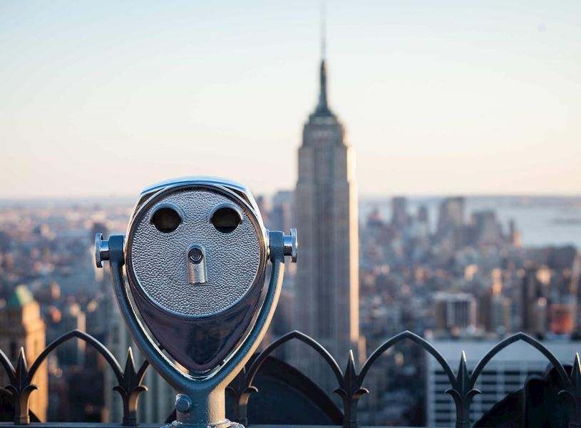 Binoculars with view of The Empire State Building in New York, USA