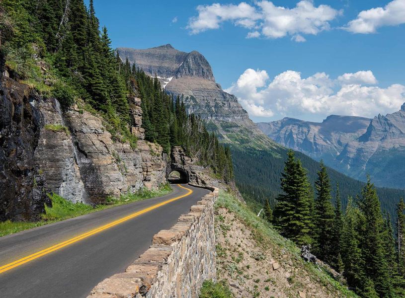 Road and mountain in Glacier National Park, USA