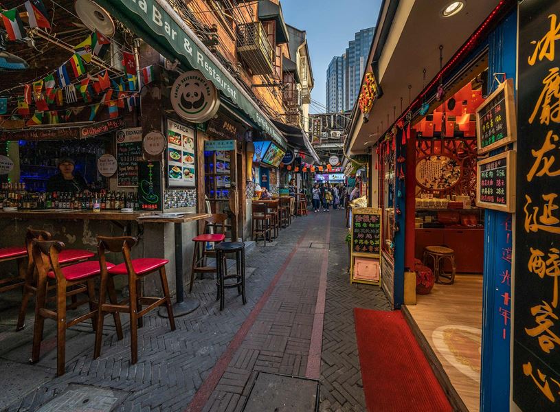 Evening view of street shops and bars in Shanghai, China