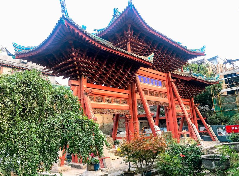 Red wooden gate with three arches at Great Mosque of Xi’an, China