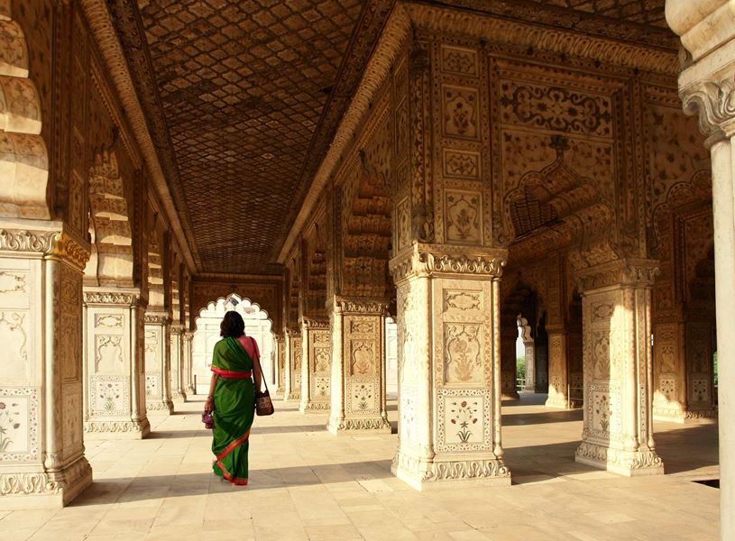 Back view of a traditionally dressed woman at Red Fort, Delhi, India