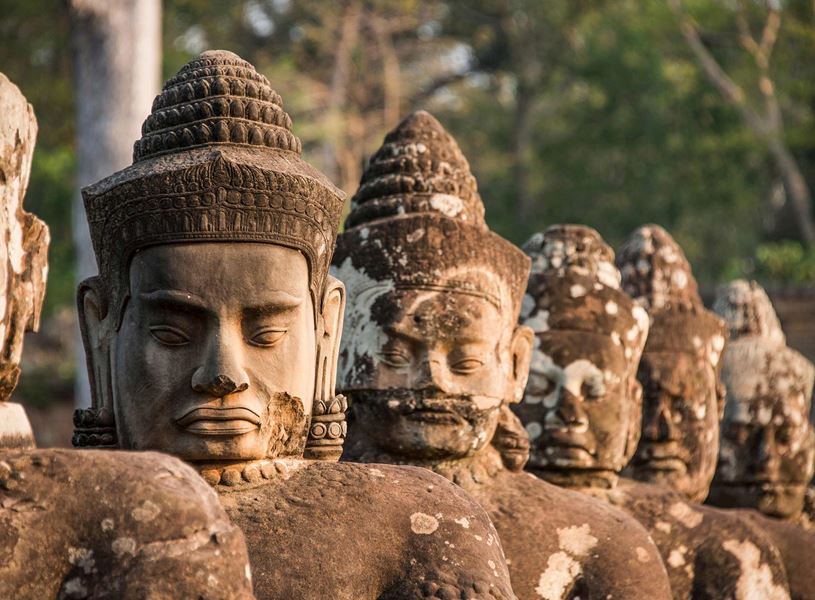 Row of carved stone statues in Angkor Thom Temple, Siem Reap, Cambodia