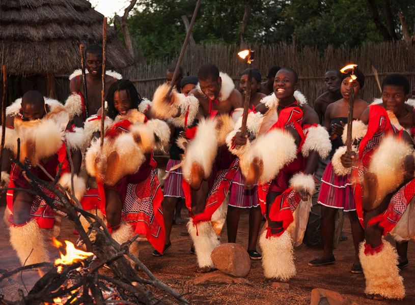 Young Shangaan warriors dancing around the fire, South Africa