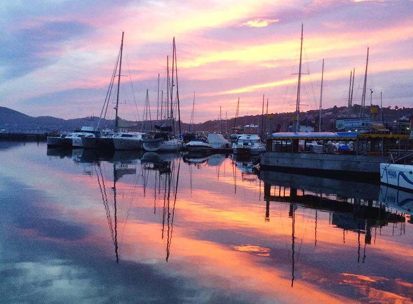 Sailboats moored at sunset in Knysna, Western Cape, South Africa