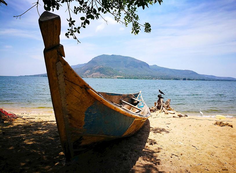 Old boat on a beach by Lake Victoria, Tanzania