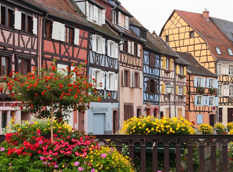 Petit Venise with half-timbered houses and flower-lined railings in Colmar, France