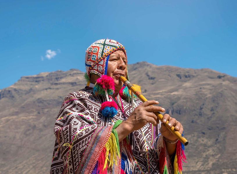 Man playing flute in Lima, Peru