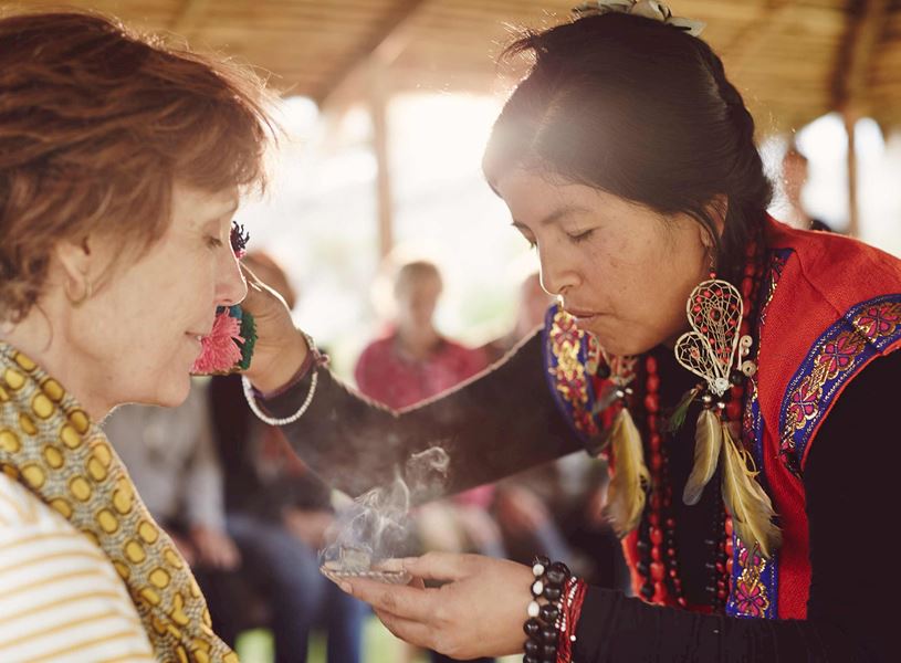 Woman performing ritual in Sacred Valley, Peru