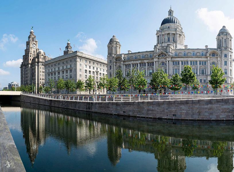 The Liverpool Pier Head reflected in the canal in England