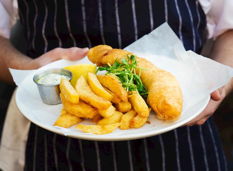 Man with Fish and Chips in London, England