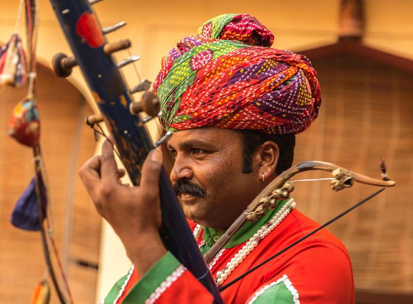 Man playing musical instrument in Jaipur, India