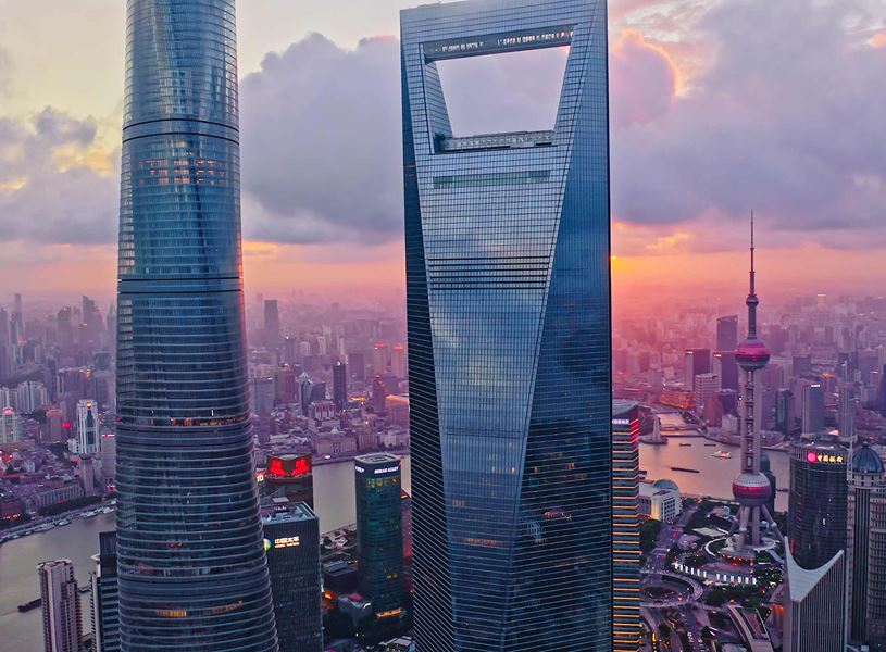 Jinmao Tower and Shanghai skyline against sunset sky, China