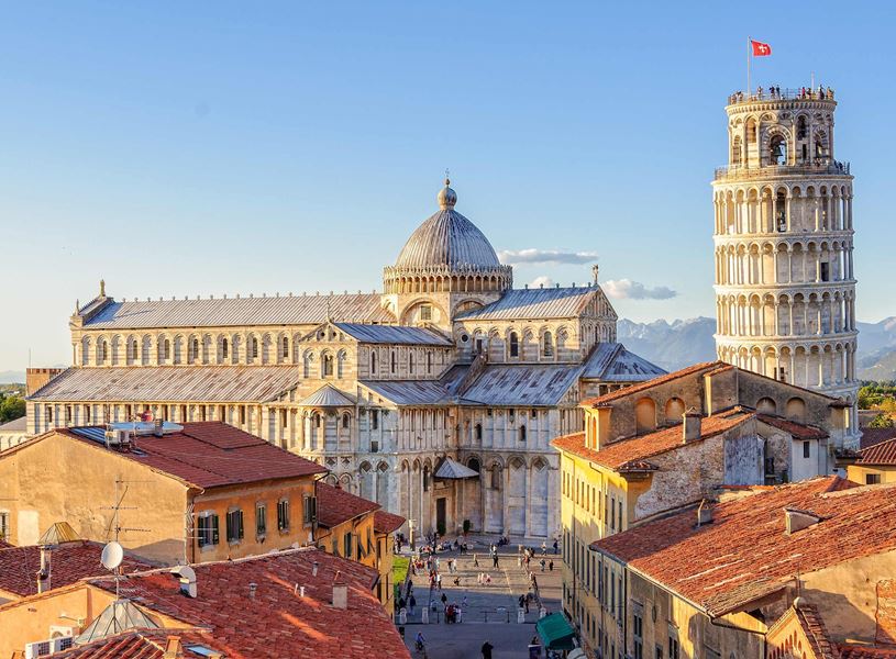 Leaning Tower of Pisa and Pisa Cathedral with red rooftops 